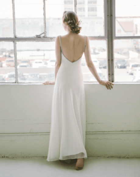 The Calista gown by Amanda Garrett is truly stunning. Silk georgette perfectly cut bias cut gown with a fine line of hand embroidered Swarovski crystals and beads to define the neckline and straps. This designer wedding dress is available to try on at The Barefaced Bride studio.