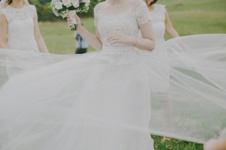 Breathtaking and unique Charlotte gown by Reem Acra. This stunning gown features an illusion neckline and nude lining. Lace bodice with off the shoulder sleeve and romantic tulle. This preloved Reem Acra gown is available to try on at The Barefaced Bride studio.