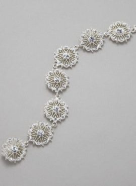 The Lace Band Crystal Bracelet by Elizabeth Bower is absolutely stunning. Featuring Swarovski elements with crystals and silver plating, this bracelet is the perfect way to add a bit of glam to your big day. This brand new headpiece is available to try on at The Barefaced Bride studio.