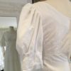 'Daffie' is a beautiful vintage gown is from the 1960s. A tiered cotton embroidered dress in size 6 - 8 $575. This vintage dress is available to try on at The Barefaced Bride studio.
